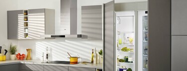 kitchen with open fridge and freezer